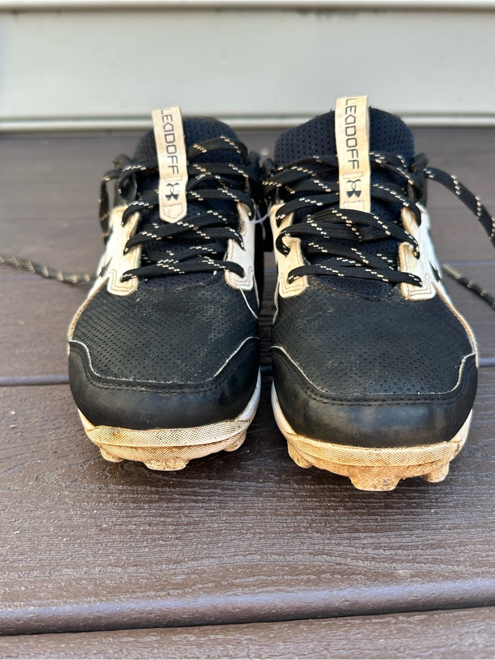 Nike Kids Black and Gold Cleats